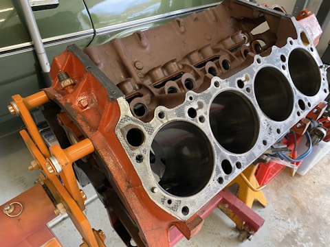 Engine blocks and mechanical parts laid out for repair.