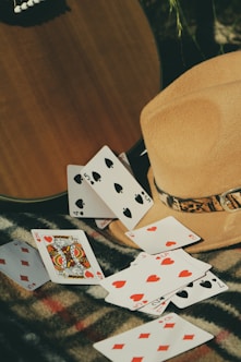 6 of diamonds and 6 of diamonds playing cards on brown wooden table