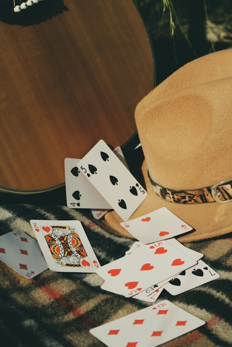 6 of diamonds and 6 of diamonds playing cards on brown wooden table
