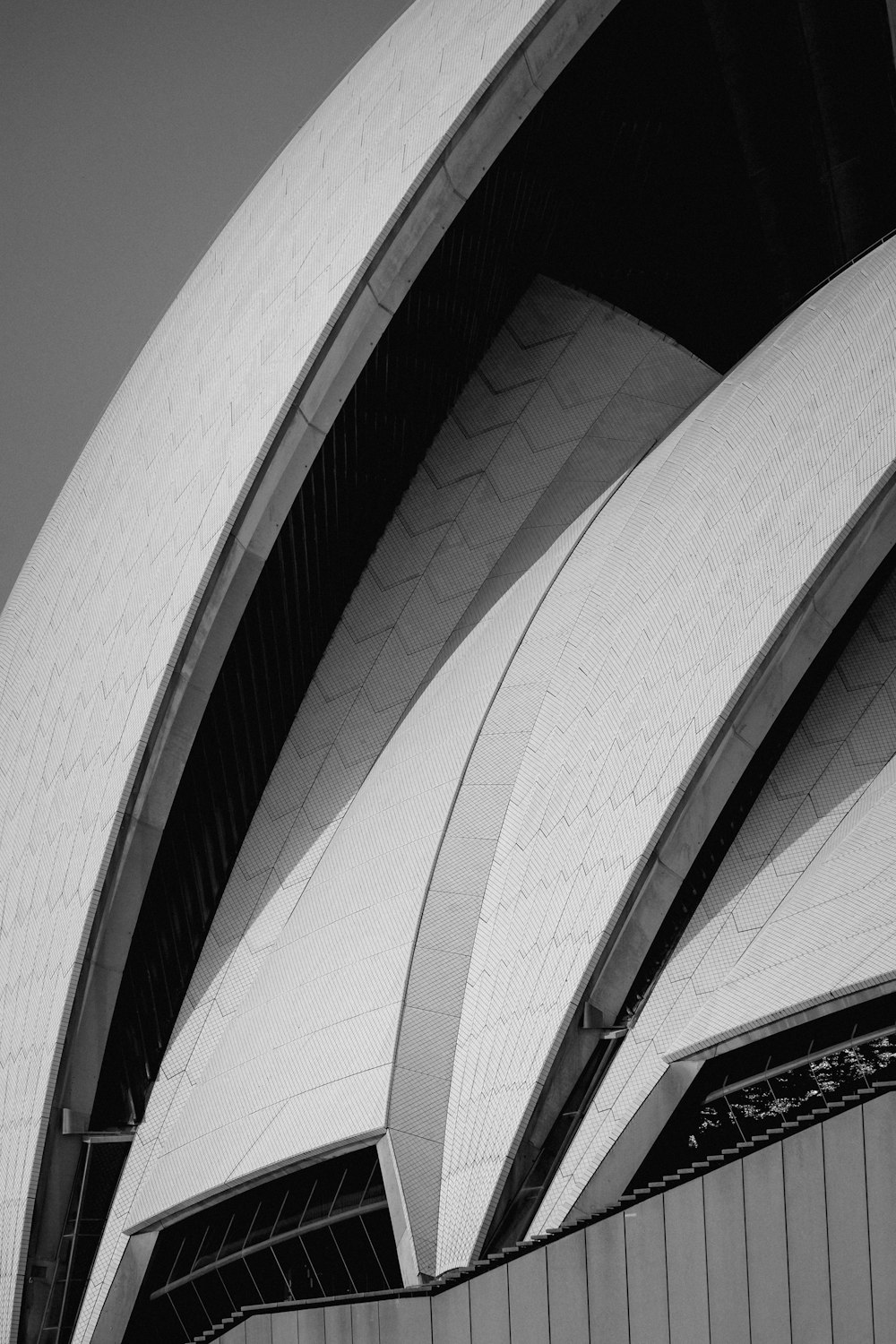 white concrete building in grayscale photography