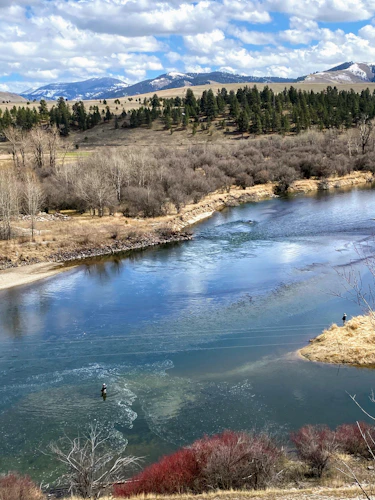 fly fishers on a river from above