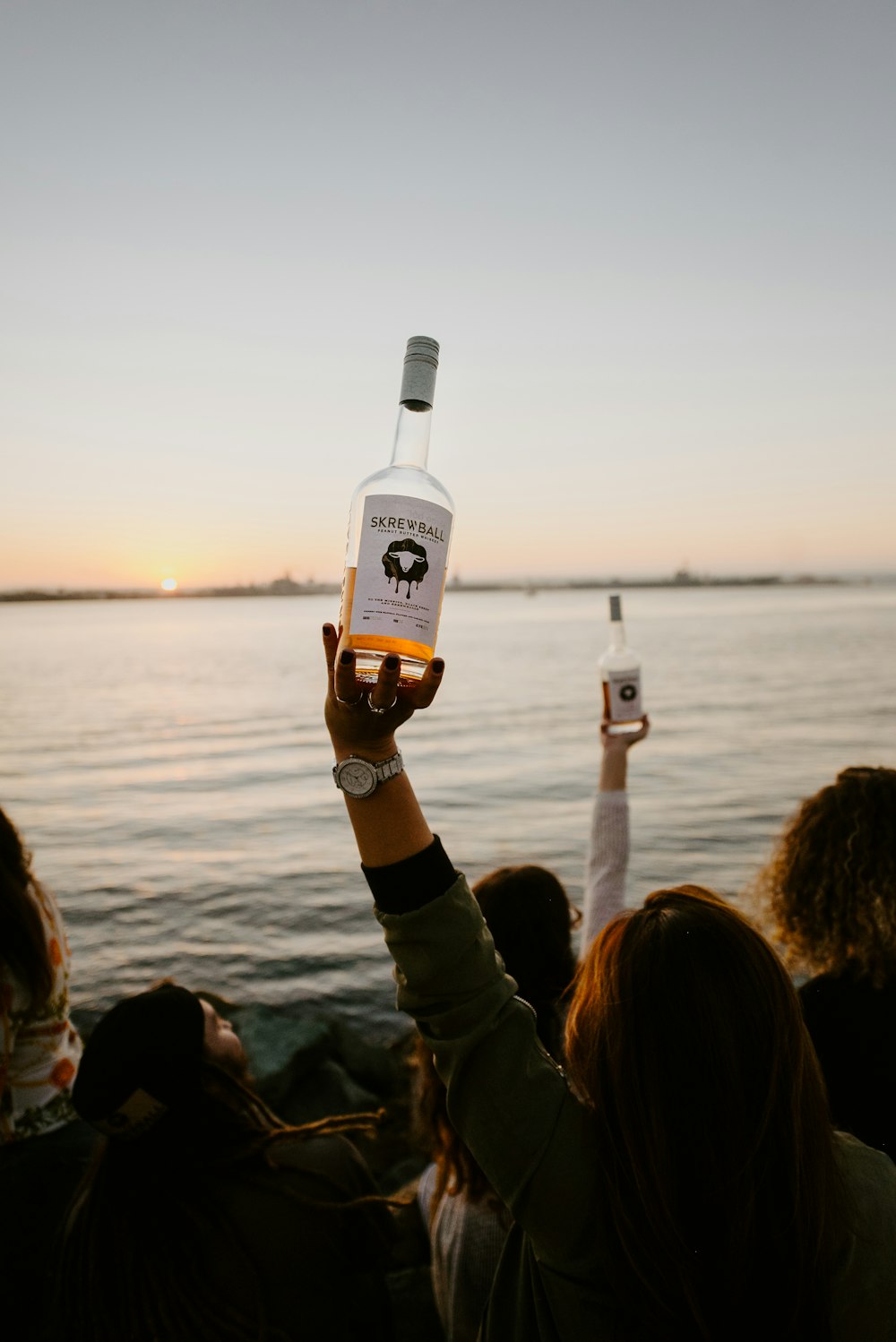 person holding white labeled bottle