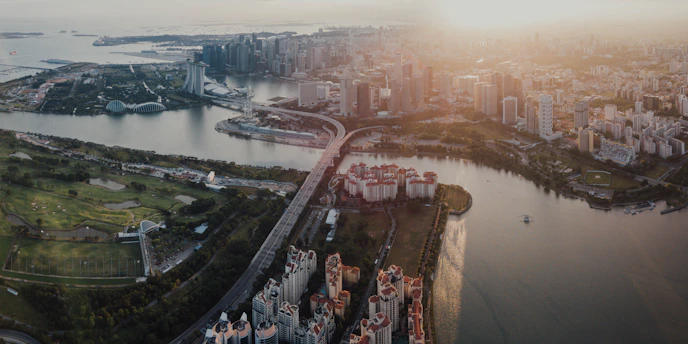 A vibrant aerial view of the city of Omra showcasing modern urban planning and green spaces.