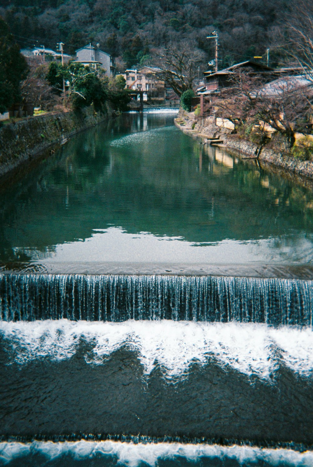 water falls in the middle of the forest