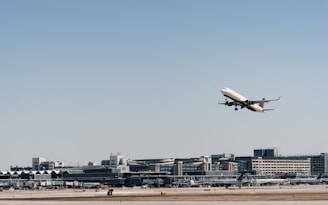 Cargo airplane taking off with clear blue sky in the background.