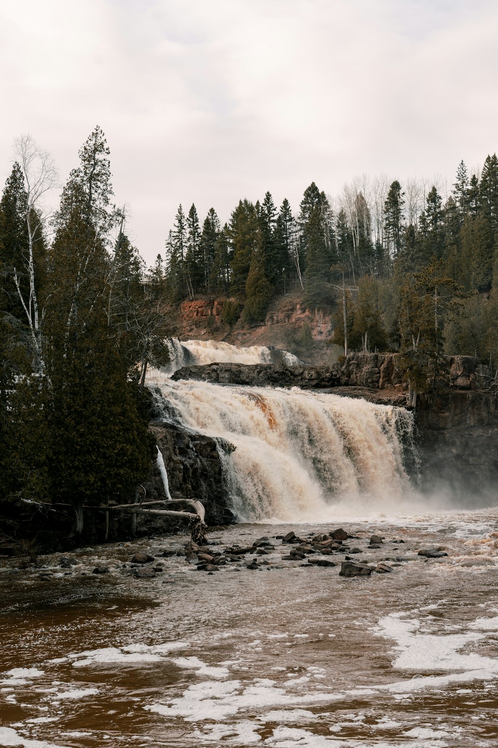 a large waterfall with lots of water coming out of it