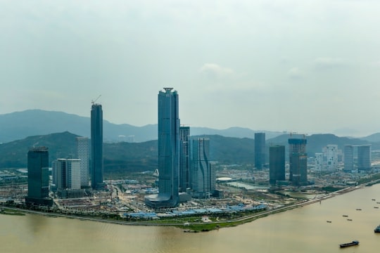 city skyline under white sky during daytime in Hengqin Island China