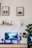 A serene home office setup with a laptop open to a video counseling session, turquoise accents visible.