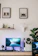 A serene home office setup with a laptop open to a video counseling session, turquoise accents visible.