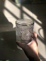 person holding gray ceramic cup