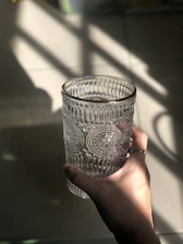person holding gray ceramic cup