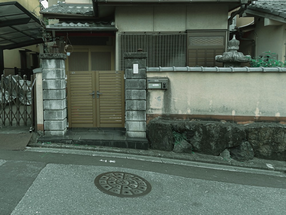 brown wooden door on gray concrete building