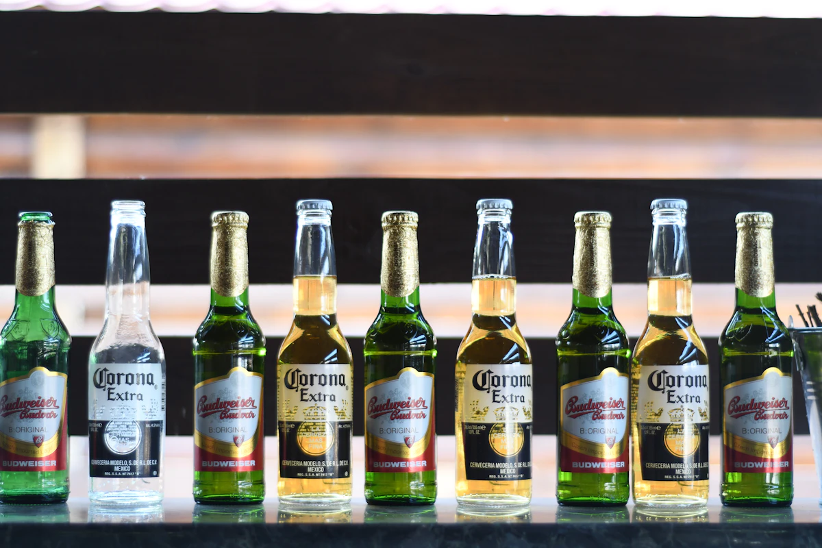 Row of alcohol bottles lined up, ready for a hand count against a bar inventory sheet