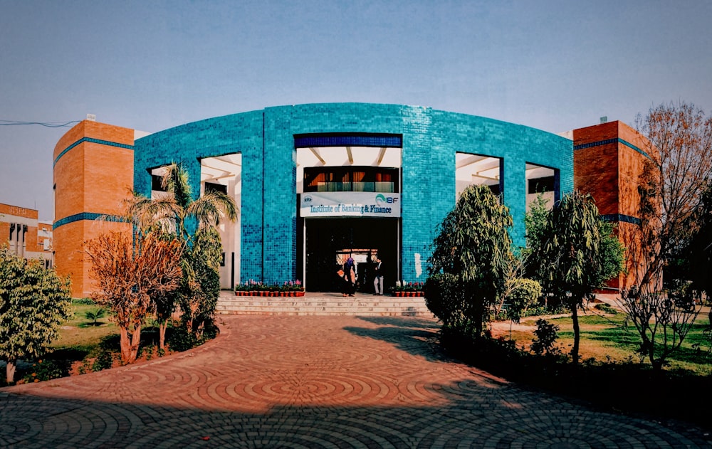 people walking in front of building during daytime