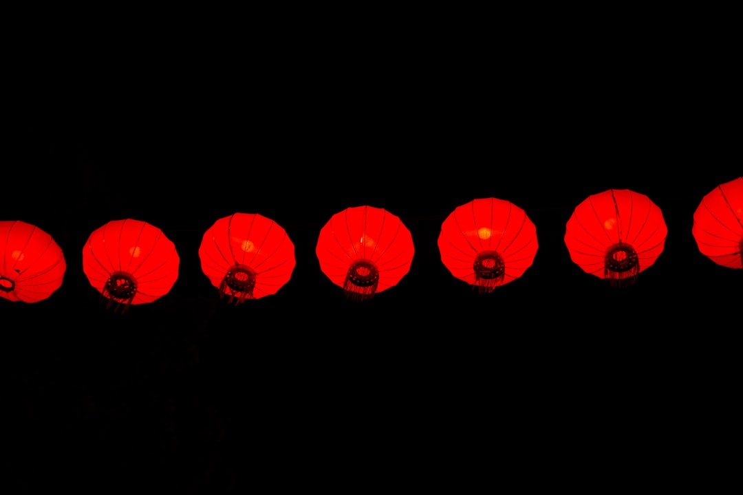red heart balloons on black background