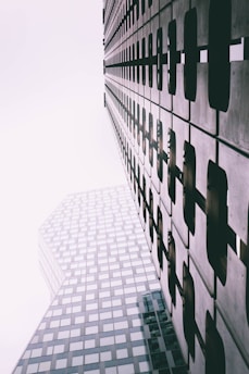 a tall building next to a very tall building