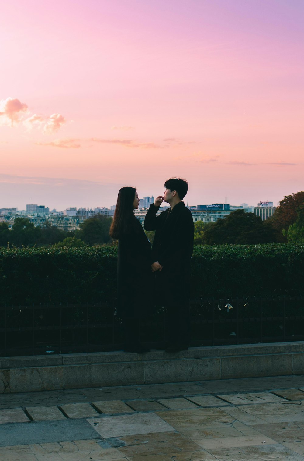 a man and a woman standing next to each other