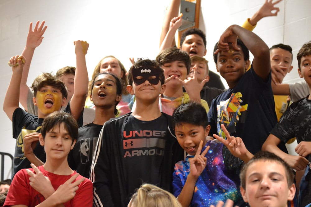 group of people raising their hands