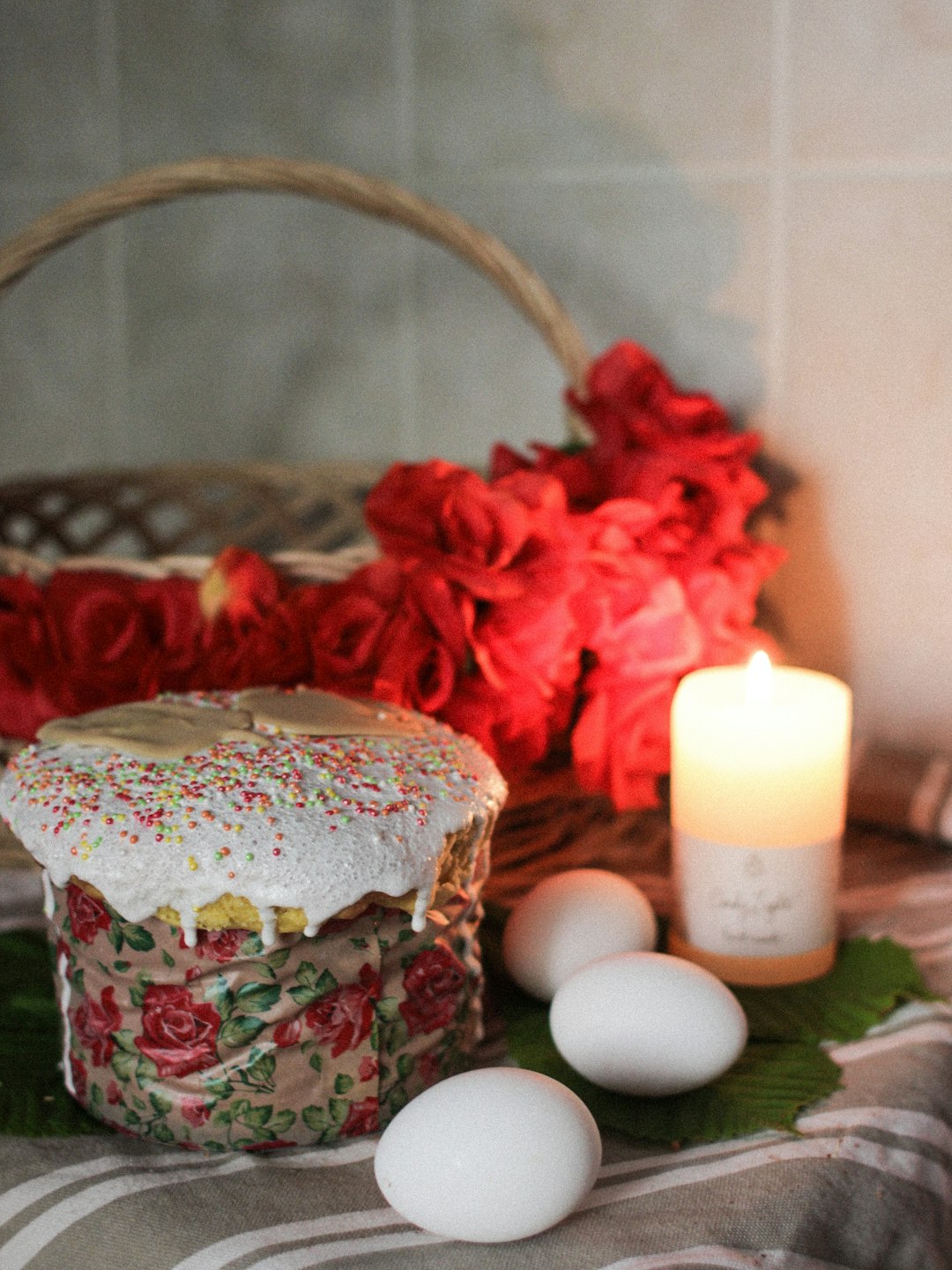 red and white rose on brown wicker basket