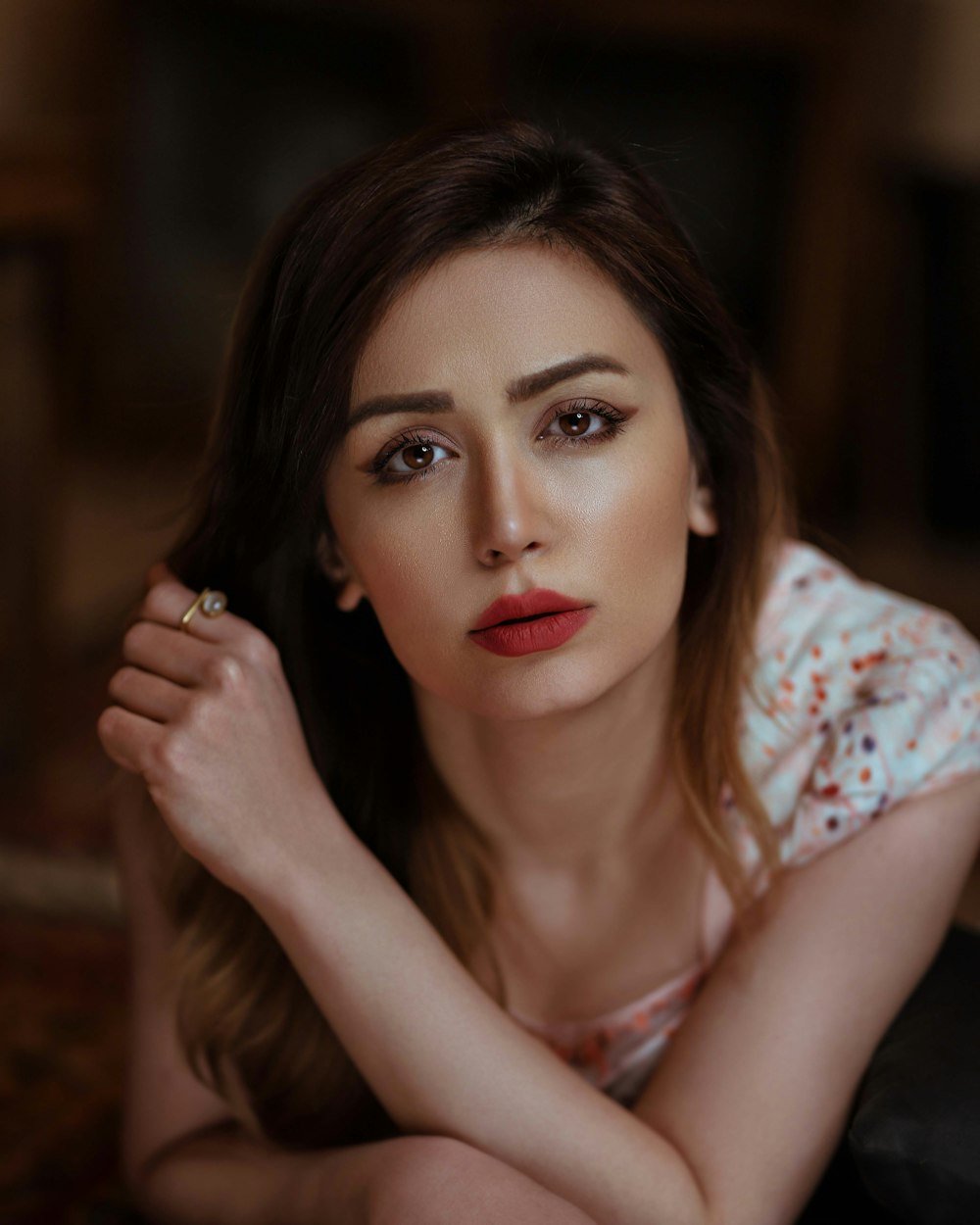 woman in white and red floral shirt