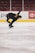 A young figure skater practicing on an ice rink, showcasing a graceful spin.