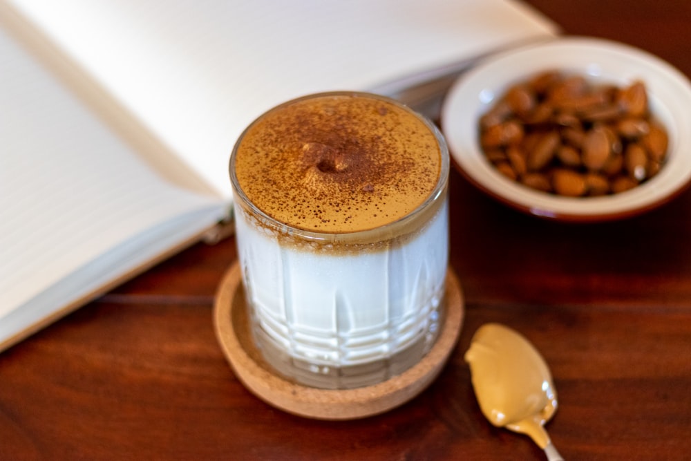 clear glass jar with brown liquid inside