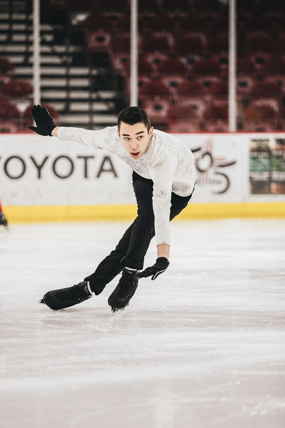 man in white long sleeve shirt and black pants wearing brown leather boots