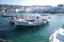 white and blue boat on water during daytime