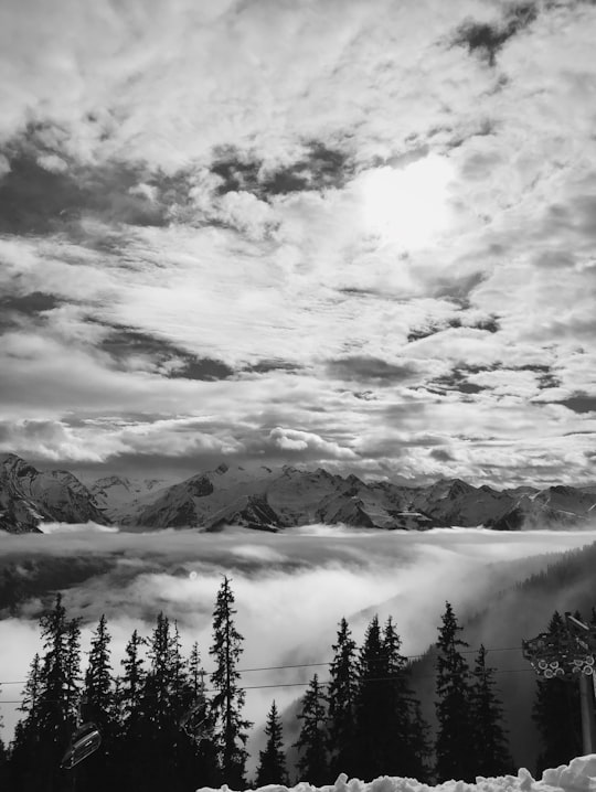 grayscale photo of mountains and clouds in Schmittenhöhe Austria