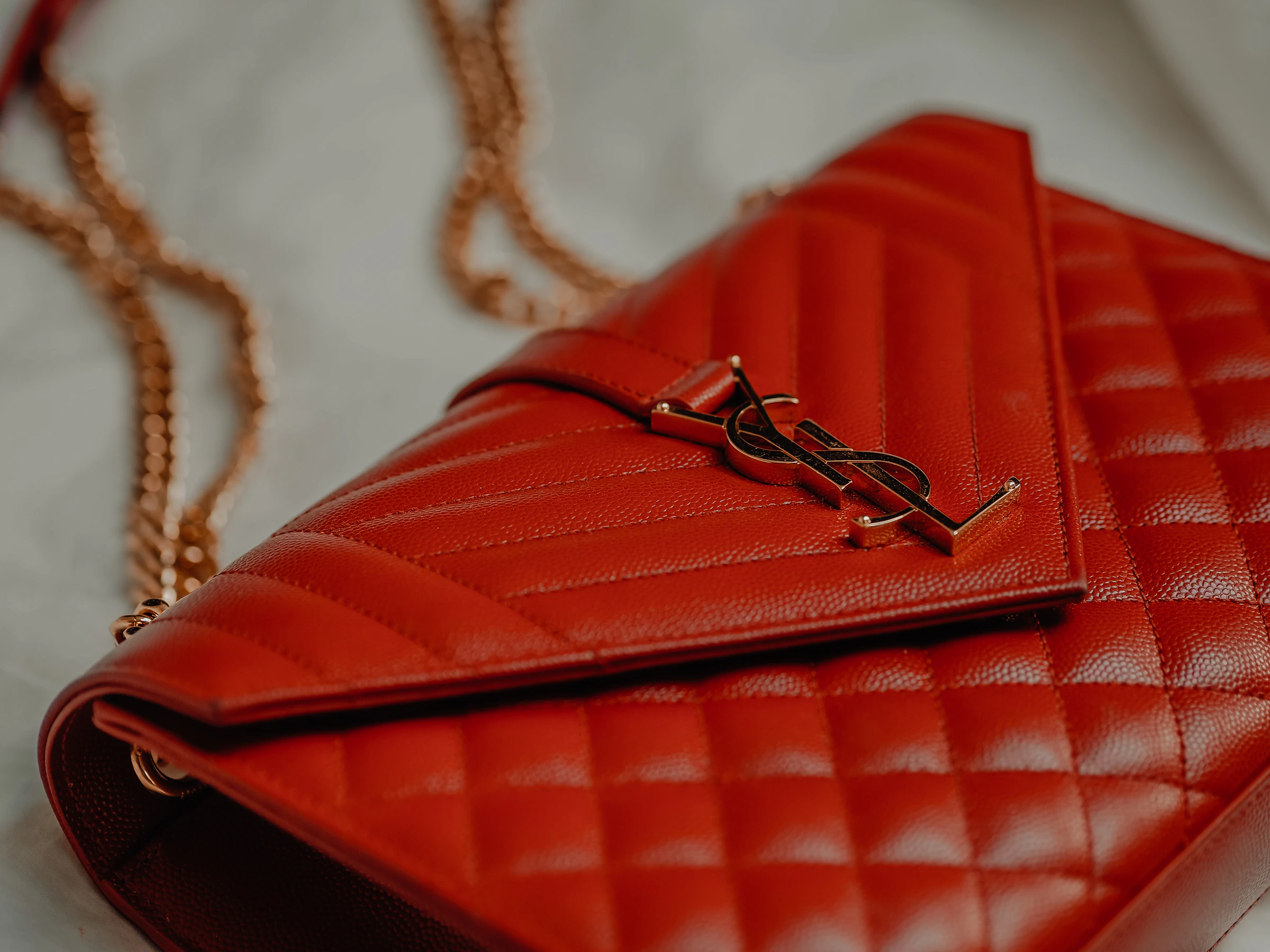 Red Saint Laurent quilted envelope bag