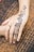 A close-up of intricate henna designs on a hand.