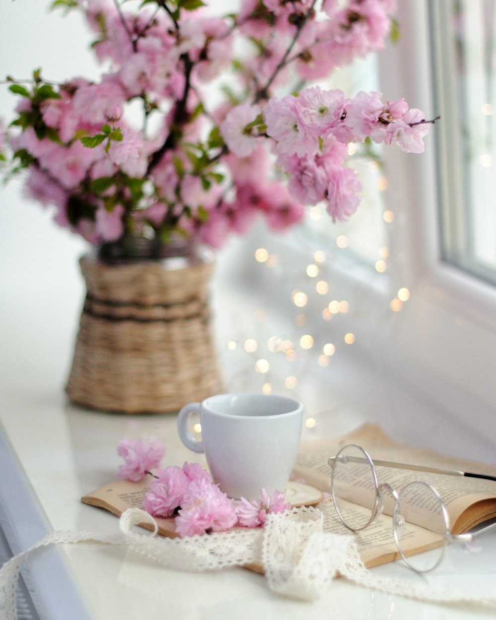 white ceramic mug on white table