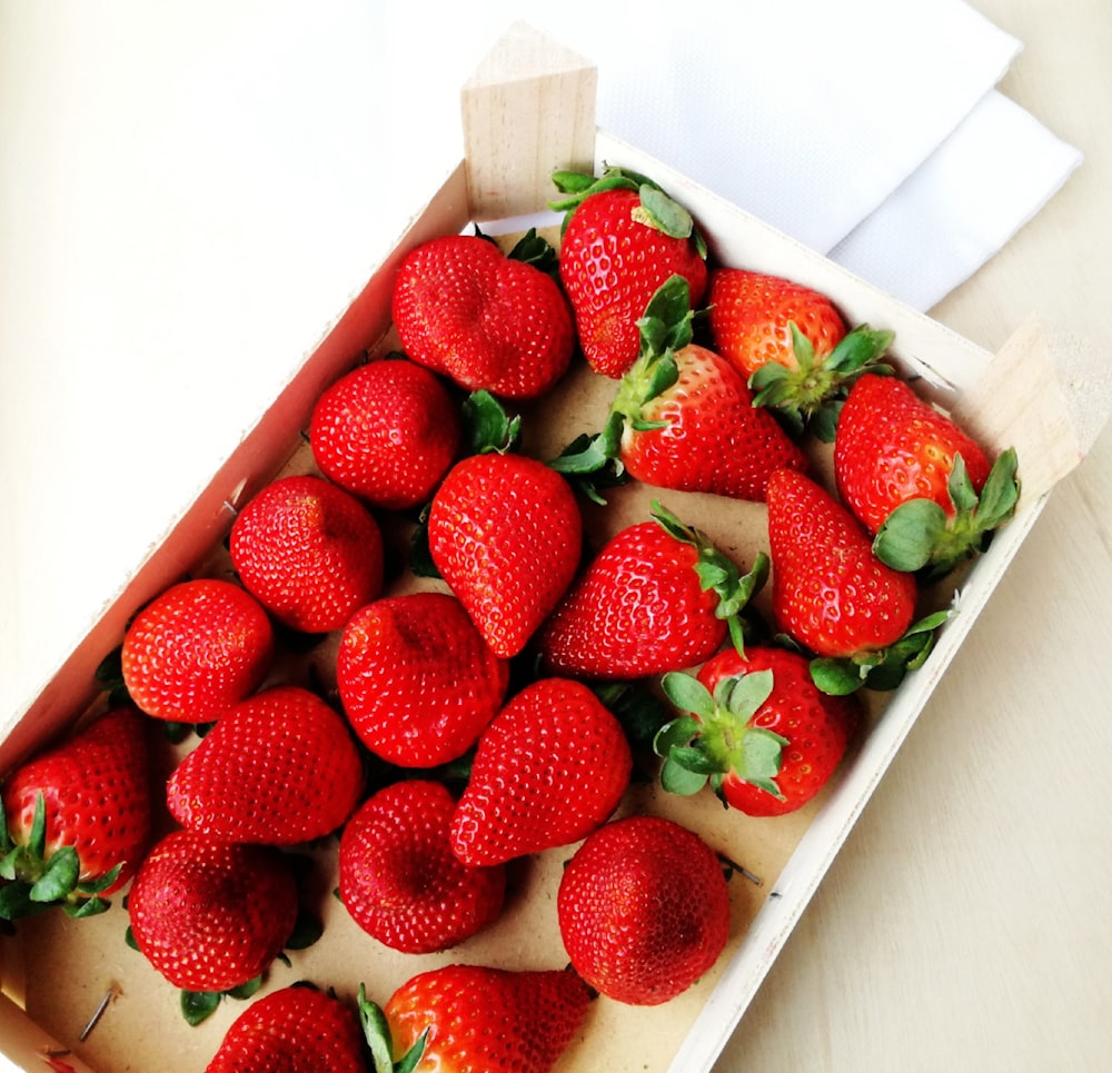 strawberries in white ceramic tray