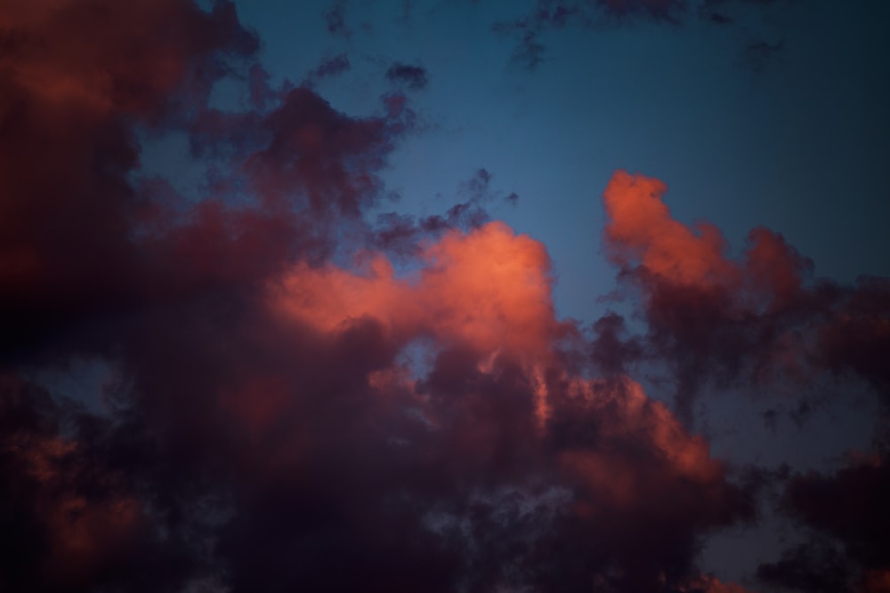 blue and orange clouds during night time