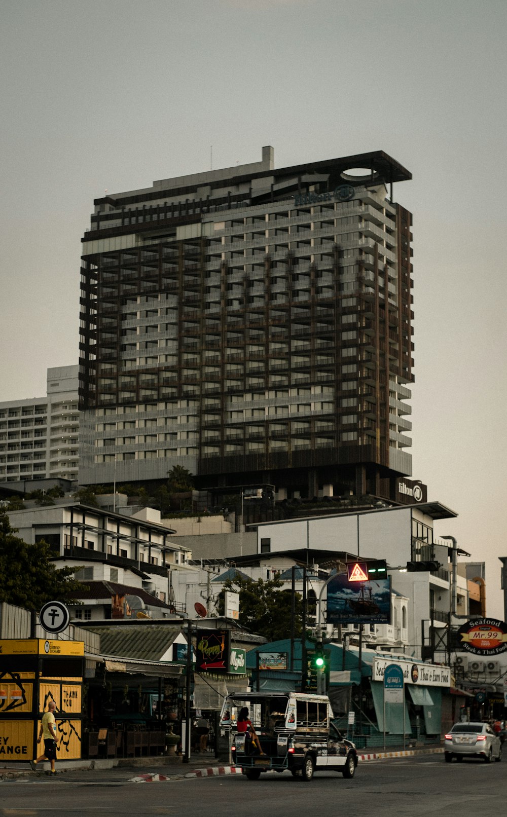 cars on road near high rise building during daytime