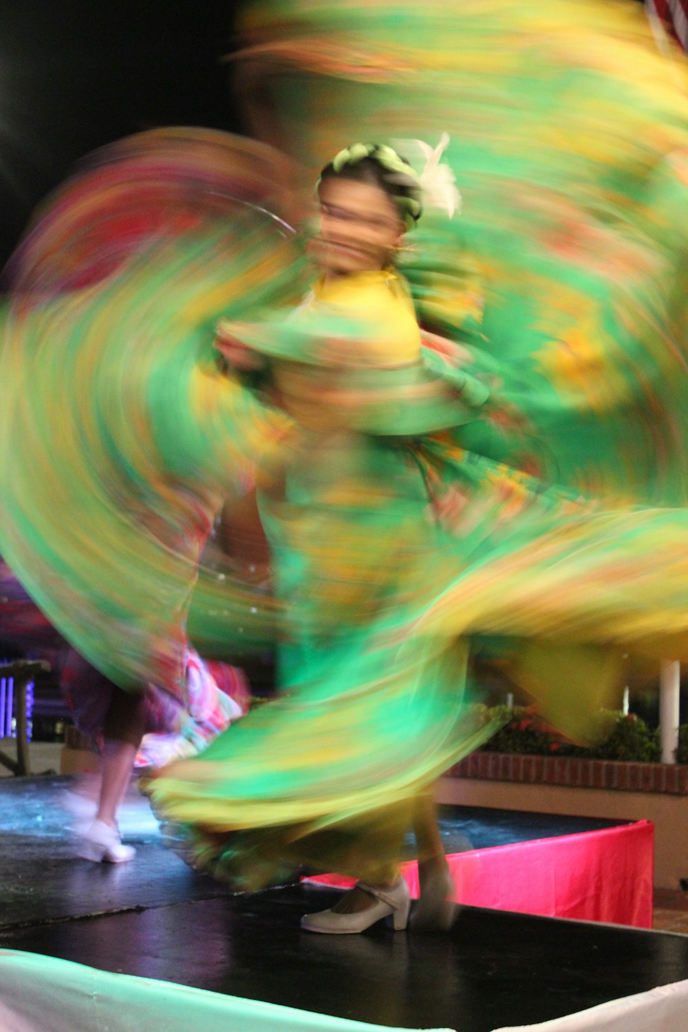 woman in yellow green and pink dress