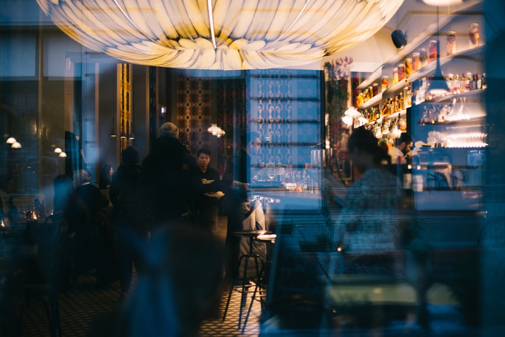 people sitting on chair inside restaurant