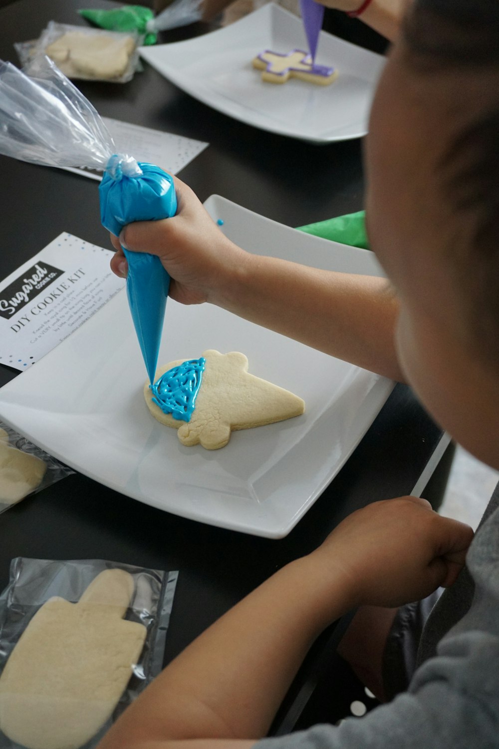 person holding blue and white plastic toy