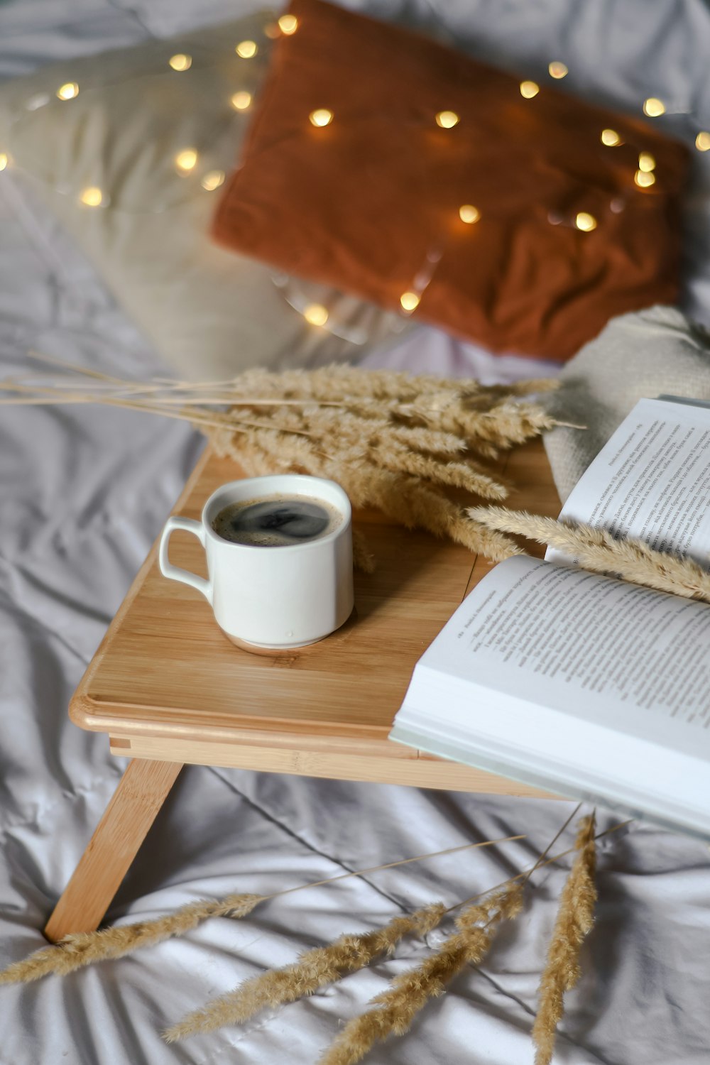 white ceramic mug on white book page