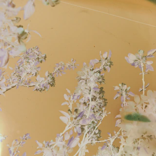 Delicate brushwork capturing a nostalgic childhood memory in warm ivory and dusty blue.