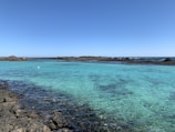 blue sea under blue sky during daytime