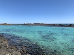 blue sea under blue sky during daytime