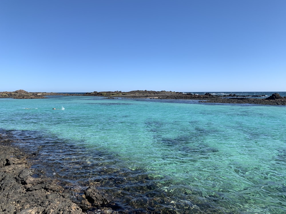 blue sea under blue sky during daytime