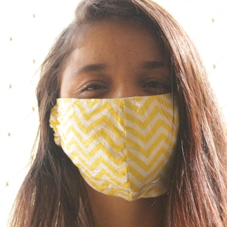 woman with yellow and white face mask