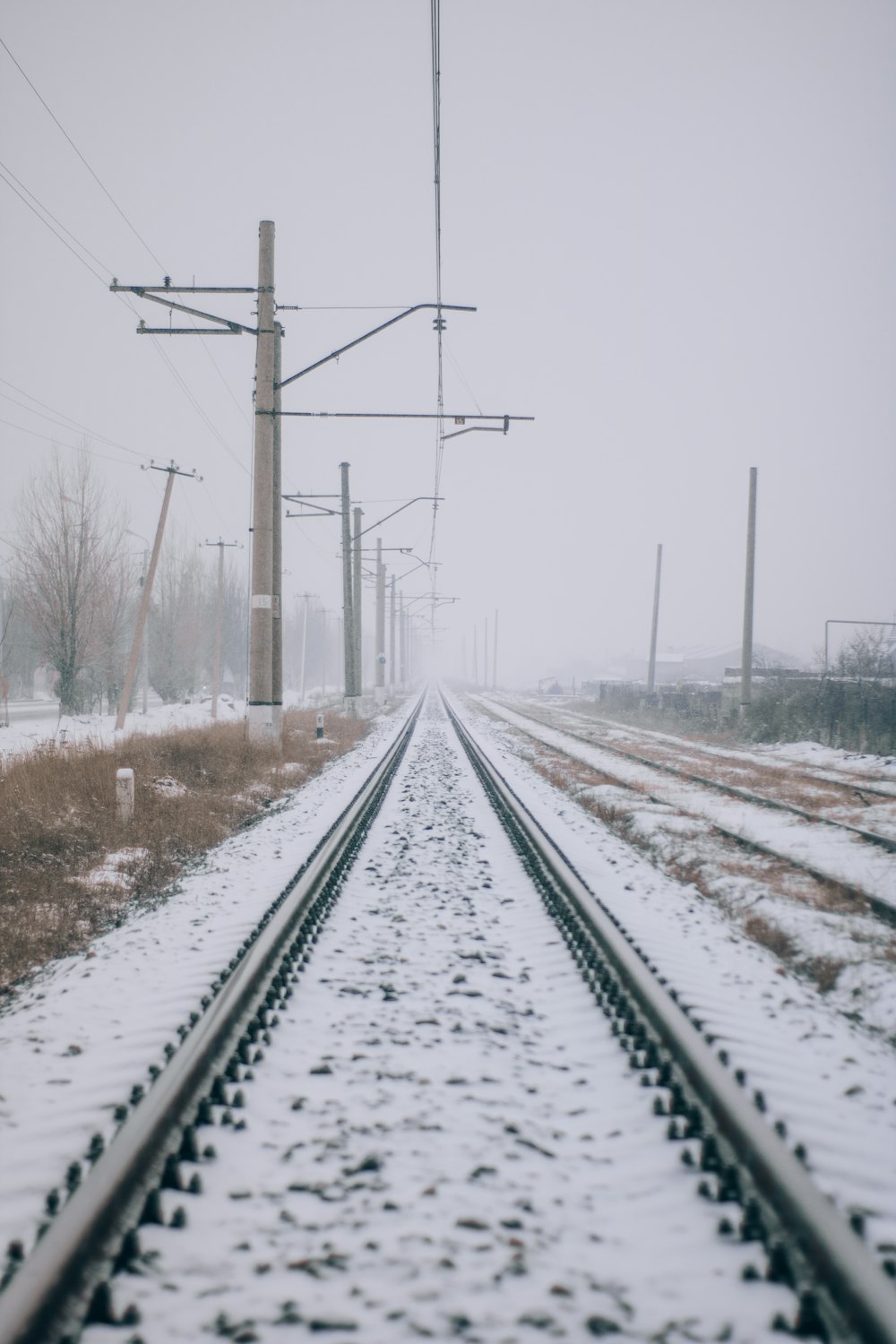 train rail in the middle of snow covered field