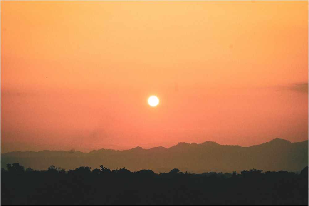 silhouette of mountain during sunset