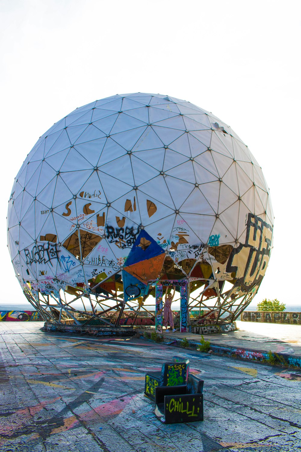 white and blue globe on brown wooden table