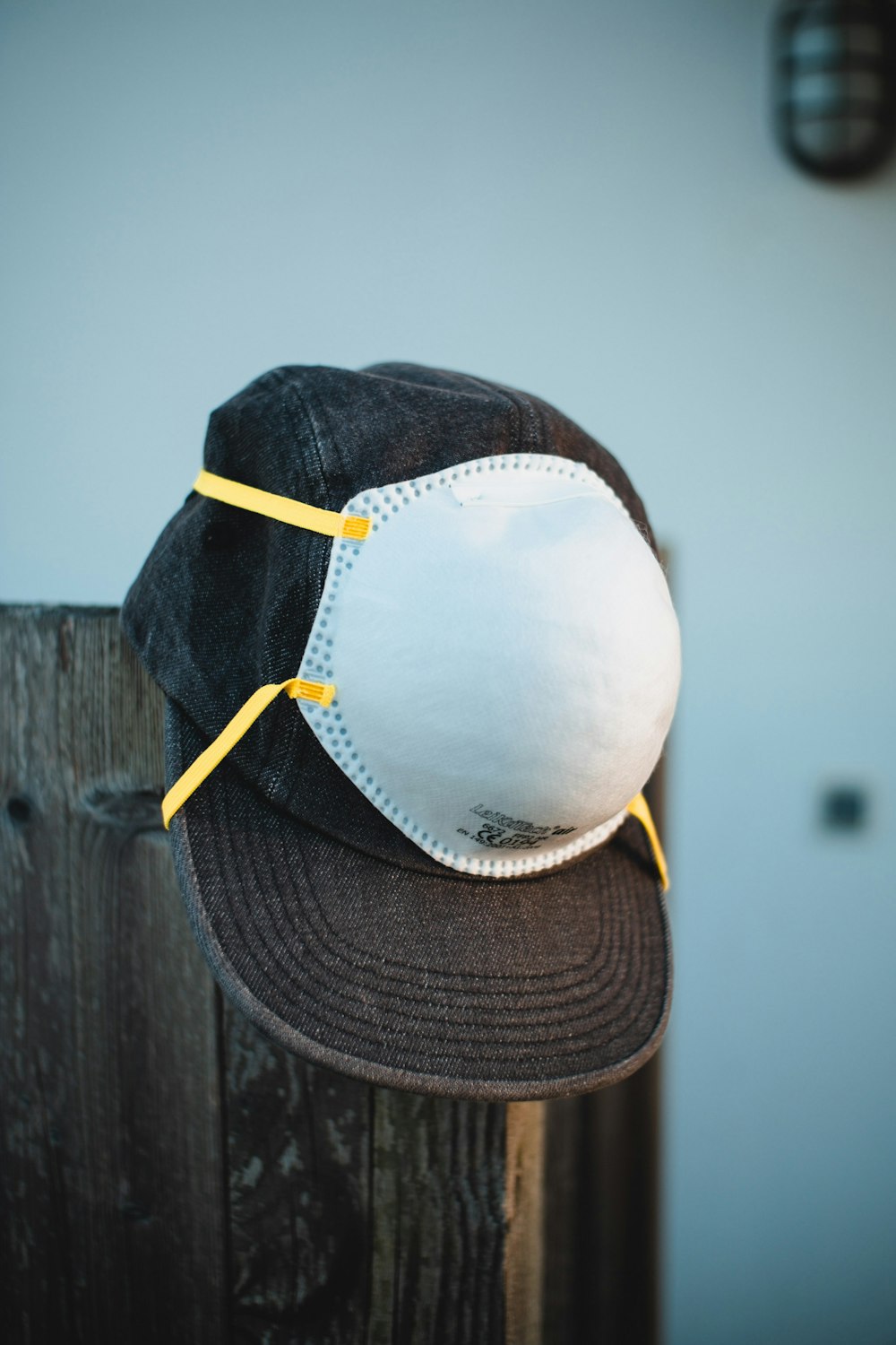 person wearing white and black baseball cap