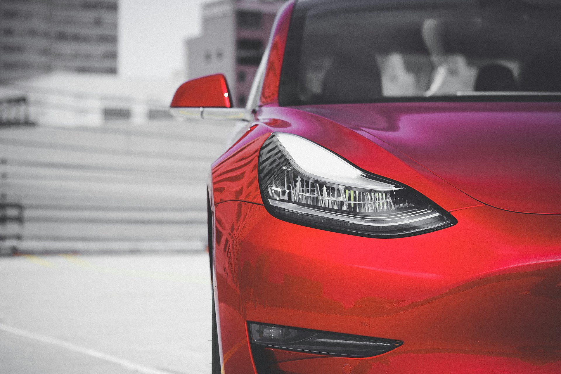red car on road during daytime