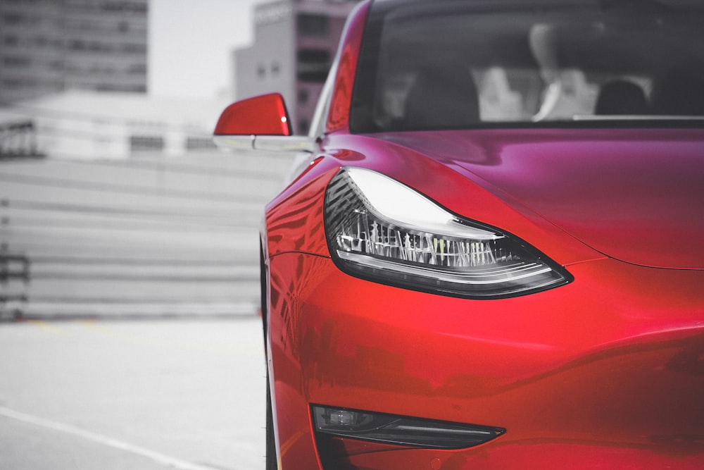 red car on road during daytime